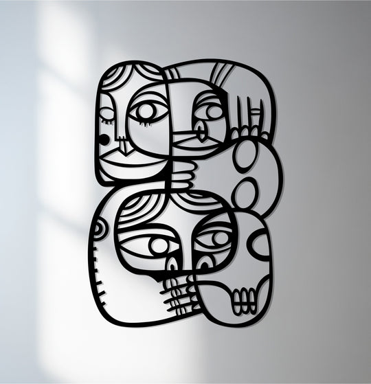 Foreground detail reveals the striking lines of abstract faces in this contemporary cubist metal wall decor, showcasing a modern art connection.