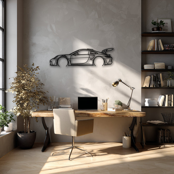 High color contrast emphasizes the sleek lines of the sport car outline metal art for wall, set against the muted gray wall in a modern office.