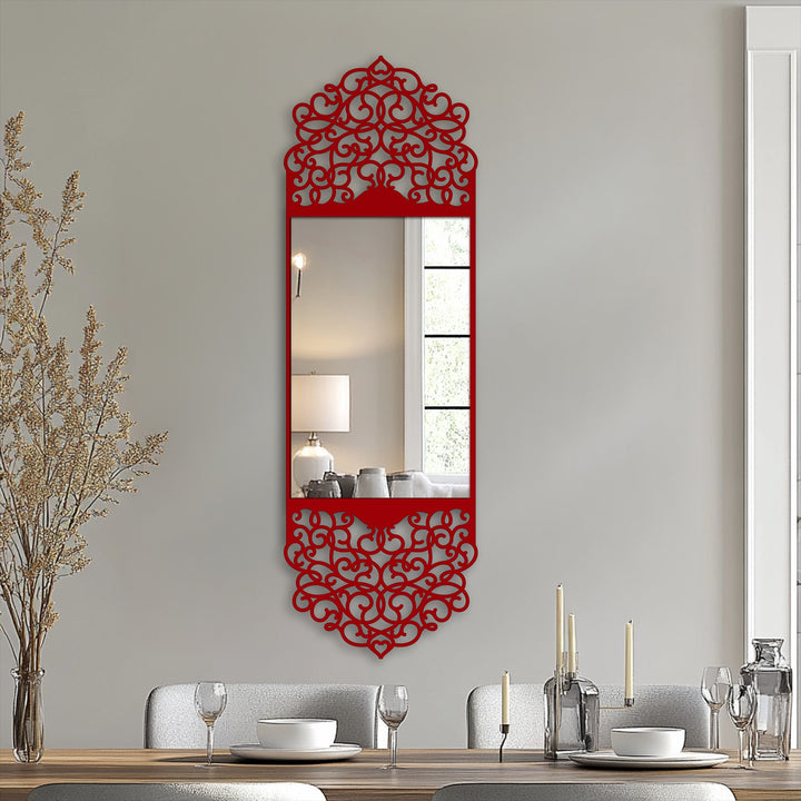 Transitioning from the reflecting glass to the red arabesque frame, this modern mirror presents unique metal wall art with an ornate arch design.