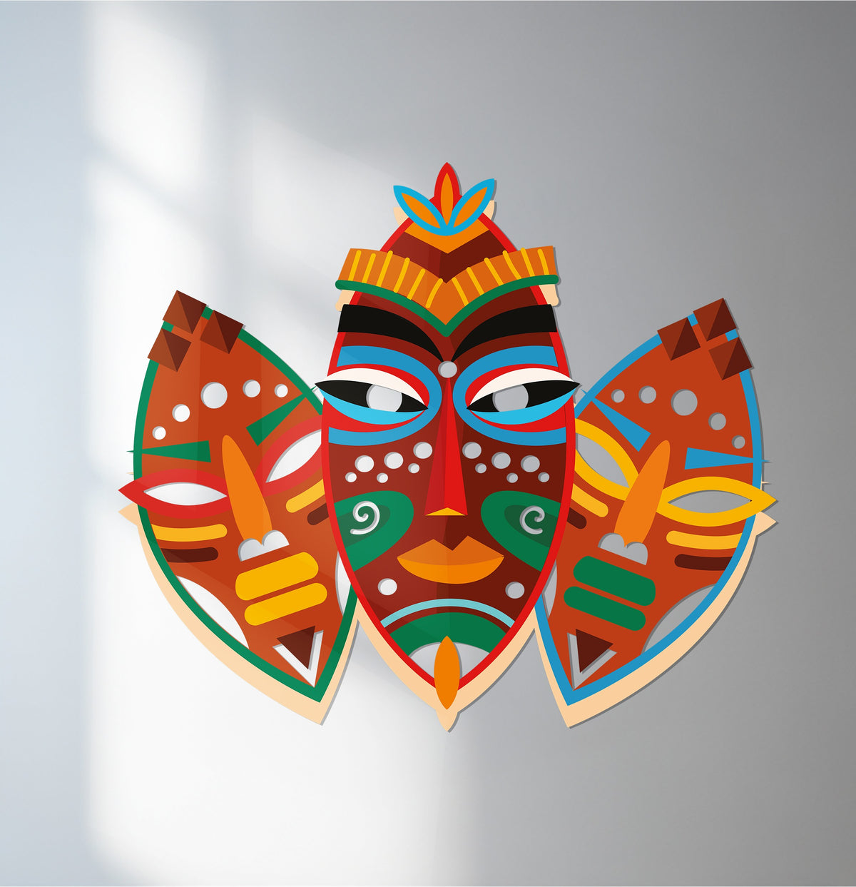 Vibrant color saturation accentuates this tribal mask decoration wall art with a colorful, African-inspired design, making it a unique and eye-catching home decor piece.