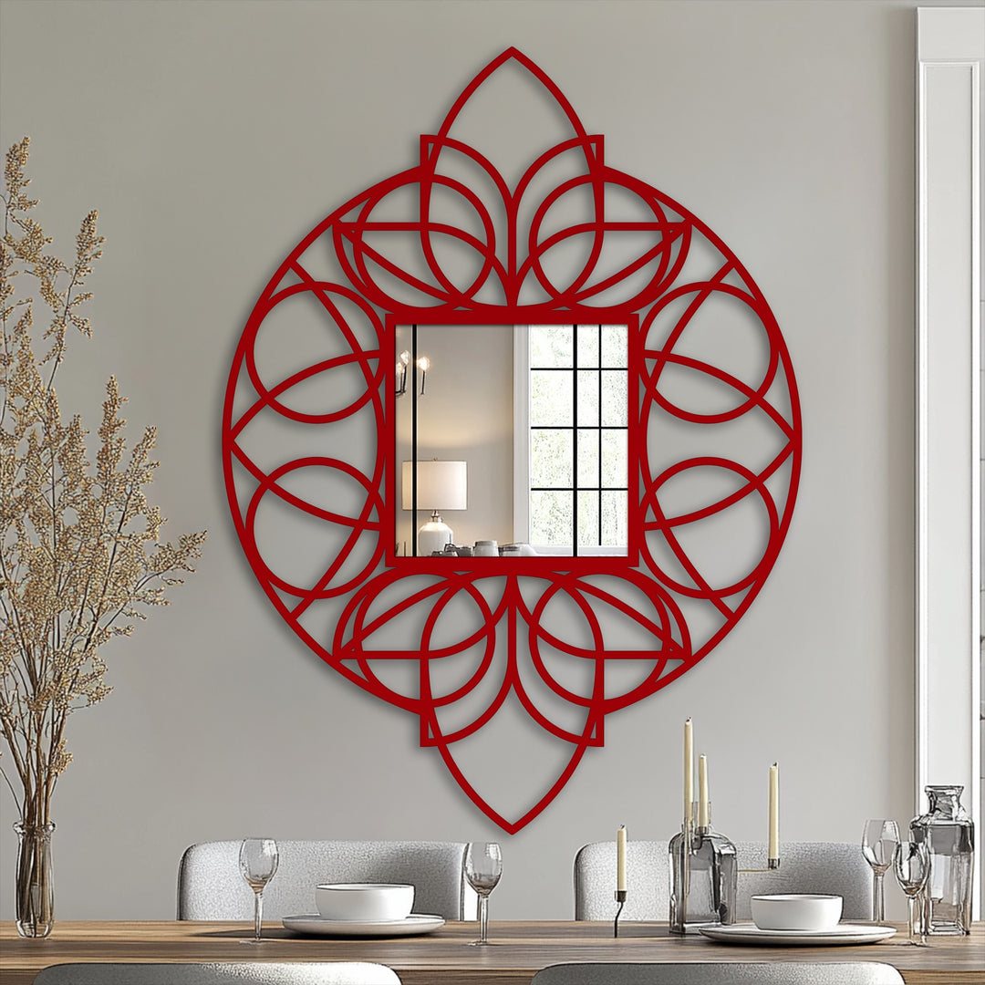 The artistic negative space in the geometric floral mandala reveals the framed wall mirror, creating a striking decorative metal artwork focal point on the wall.