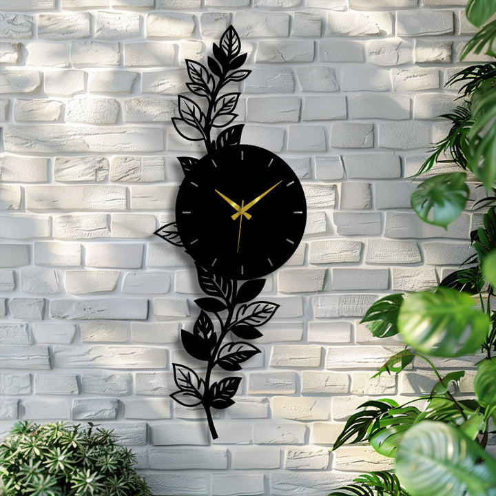 Against a textured white brick background, the botanical leaf metal wall clock provides a contrasting element of nature-inspired home decor.