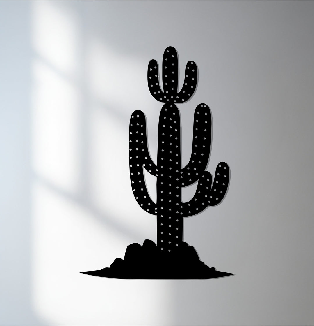 Black dominates this decorative metal art piece of a saguaro cactus in a desert landscape, perfect for modern wall decor.