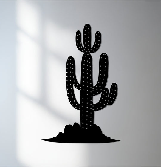 Black dominates this decorative metal art piece of a saguaro cactus in a desert landscape, perfect for modern wall decor.