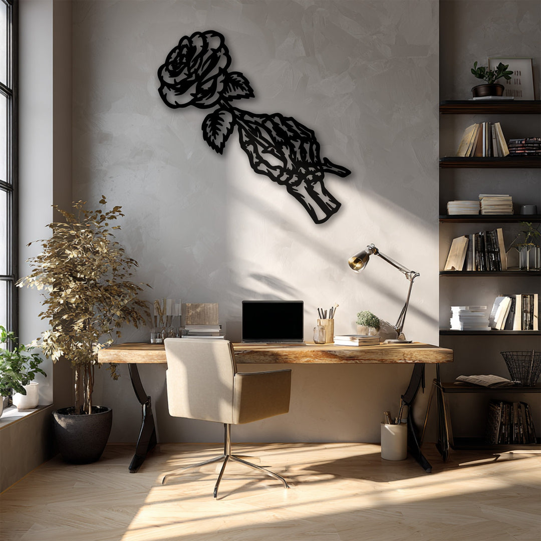 Bright sunlight and deep shadows highlight the intricate design of a unique metal wall art featuring a gothic rose skeleton.