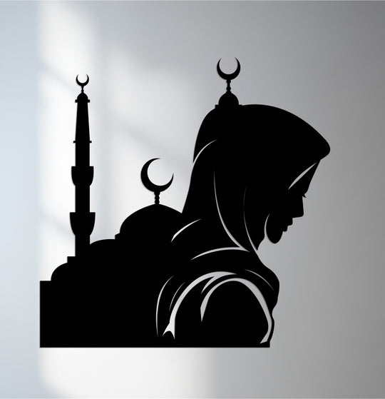 Illuminated by the brightest area, this metal wall decor showcases a prayerful woman silhouette against a mosque and crescent design, a stunning piece of Islamic art.