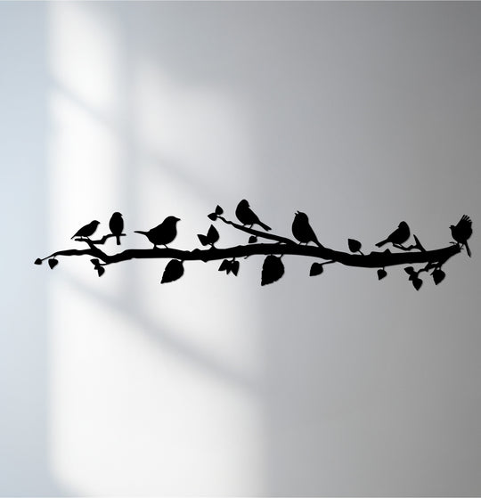 Negative space highlights the delicate branches and birds silhouettes in this metal art for wall, creating a captivating and nature-inspired focal point.