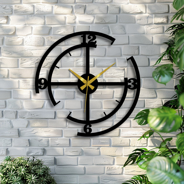Sweeping golden hands create a dynamic sense of movement on this modern black geometric metal wall clock, making it a unique metal wall art piece.