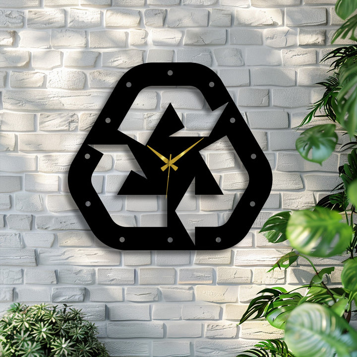 Geometric metal wall decor clock features a recycle symbol with minimalist design and gold hands, creating an eco-modern focal point.