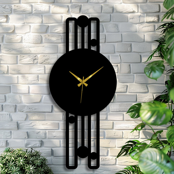 Light and shadow play across the elegant vertical metal wall clock's minimalist geometric frame, creating a striking contrast in this piece of metal wall decor.