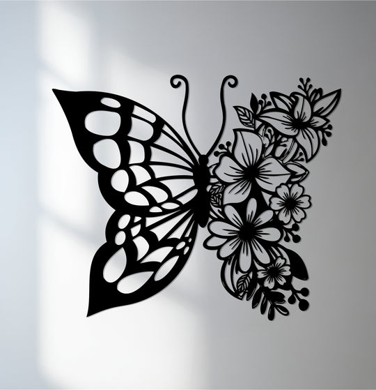 Delicate light and shadow interplay accentuates the intricate details of this floral butterfly metal wall decor, casting subtle gradients across its elegant design.