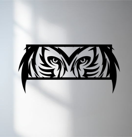 Negative space creates the owl's eyes in this mystic, modern wildlife decor, crafted from unique metal wall art with tribal details and a stunning matte black finish.