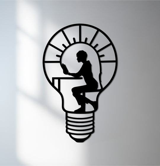 Vertical creative thinker metal wall art in a light bulb shape offers unique metal wall art for a bright mind.