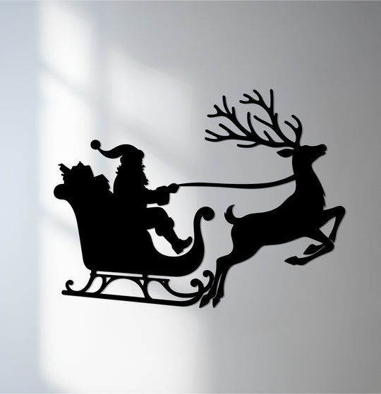 Cool color temperature highlights the laser-cut Santa's Sleigh Ride Christmas Reindeer decorative metal art, creating a festive silhouette on the wall.