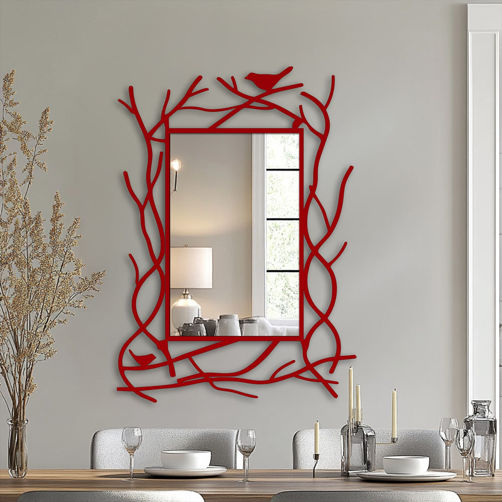 Featuring a sleek, red coating, this nature-inspired branch frame adds an eye-catching element to the black metal floor decorative mirror with charming bird details.