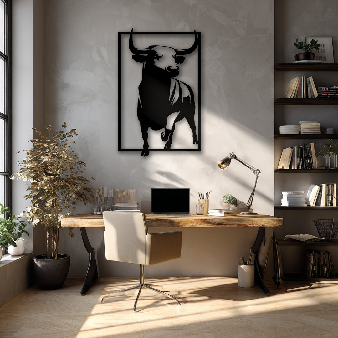 Sunlight dramatically illuminates the polished floor and textured wall, highlighting the bold bull metal art for wall above a desk.