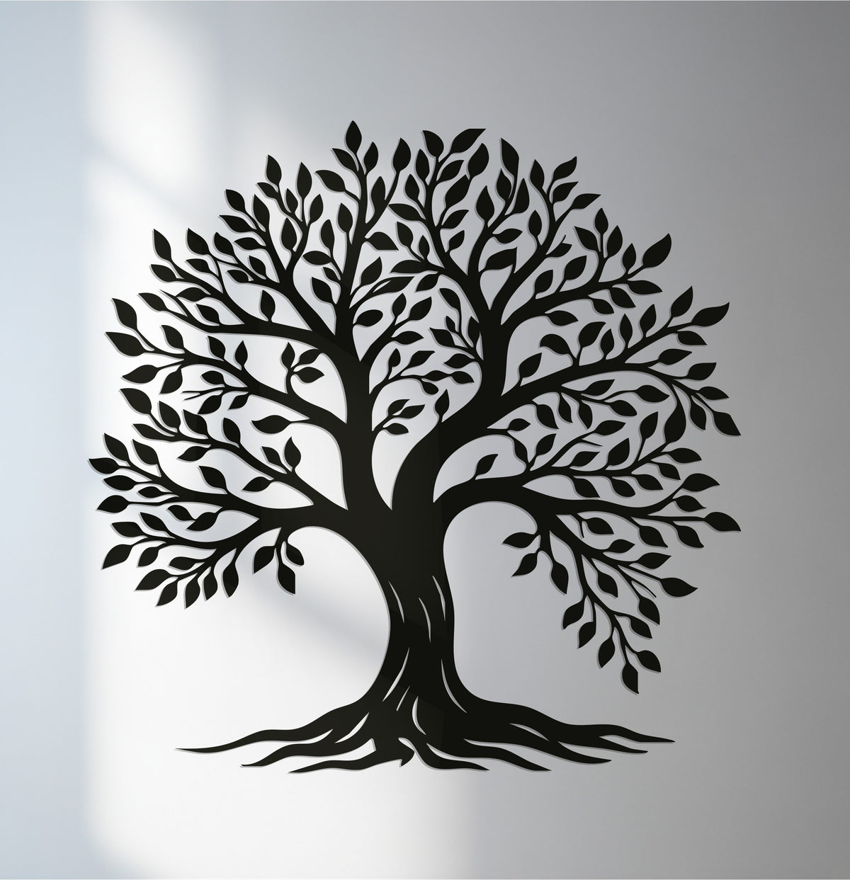 Visual rhythm is achieved in this tree of life design through the balanced arrangement of branches and leaves in this elegant metal artwork.