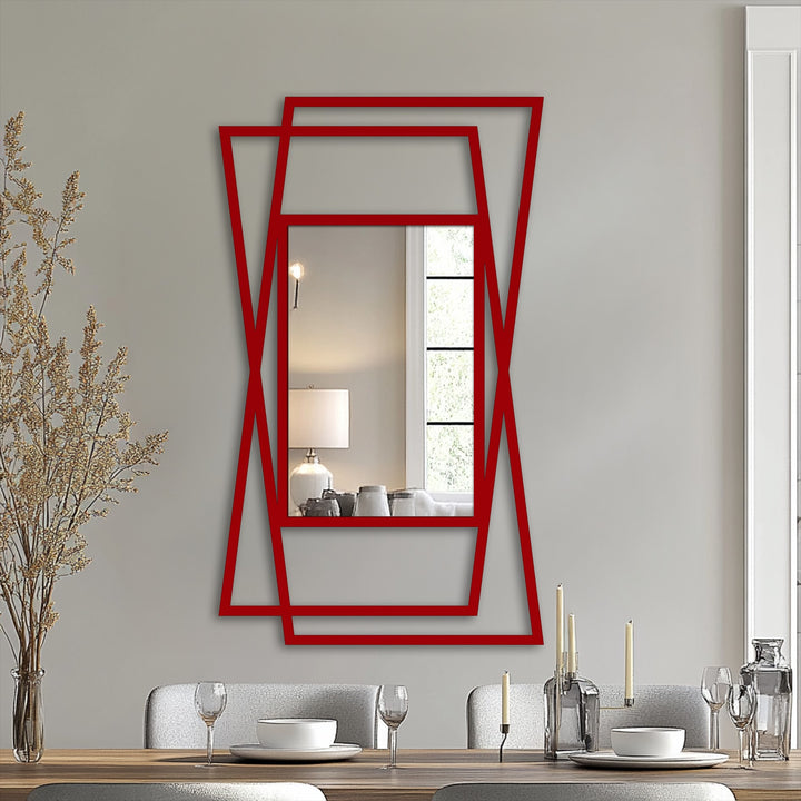 Vertically oriented decorative mirror features a striking red angular overlap geometric frame, adding modern lines and unique shape to the floor mirror design.