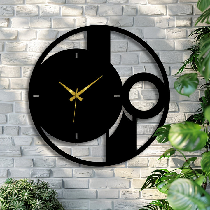 Horizontally oriented, the round abstract metal wall clock features geometric shapes offering decorative metal art with minimalist appeal.