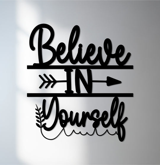 Believe in yourself metal artwork creates visual rhythm with its flowing script and bold arrow design.