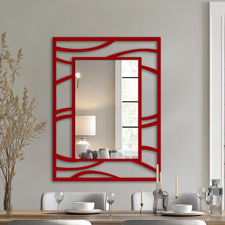 Dominant red hue accentuates the abstract wave frame of this modern metal wall decor, creating a striking statement mirror with a fluid line design.