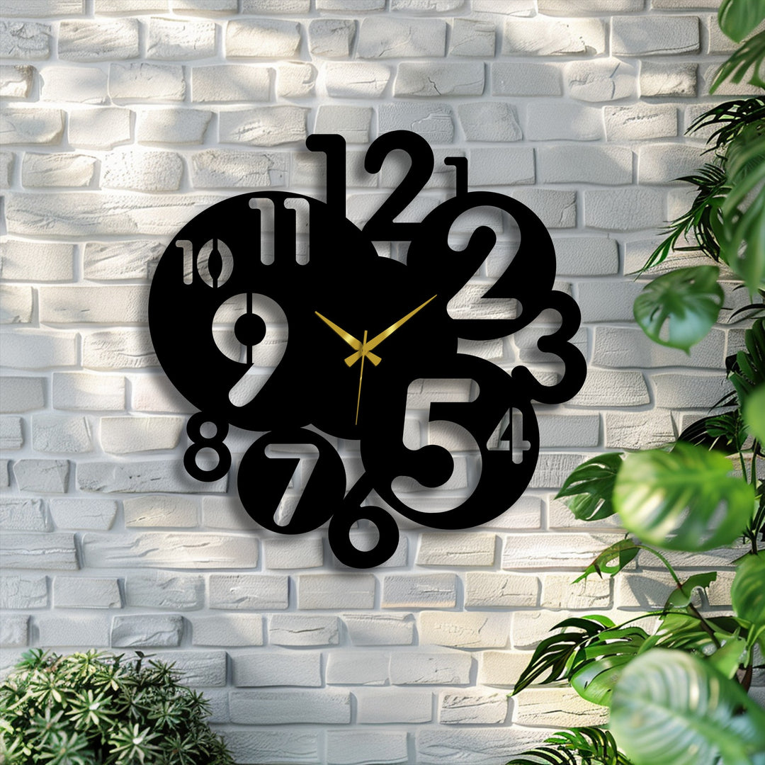 Bold black metal art for wall features a modern abstract number clock with gold hands against a bright white brick wall.