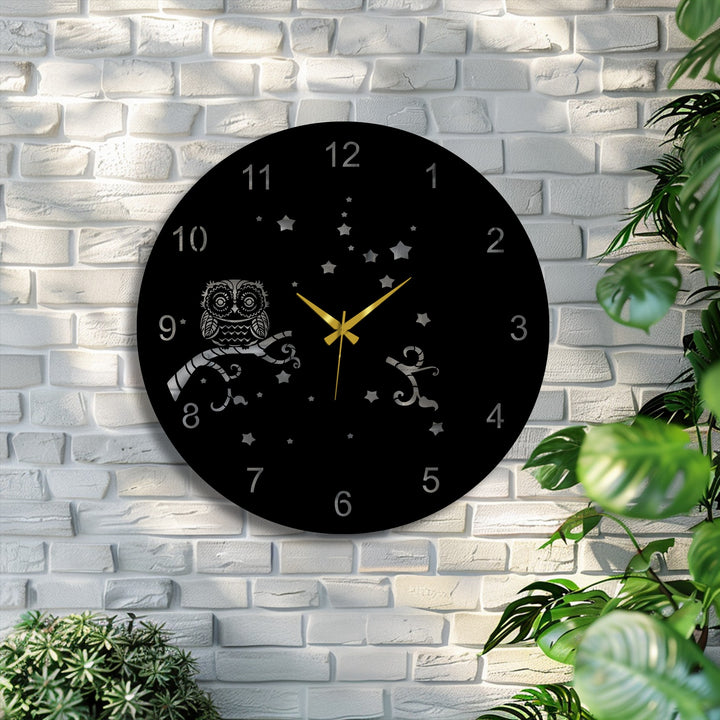 This decoration wall art showcases the realistic detail of the Owl Night Metal Wall Clock with an intricate owl, branch, and starry sky.