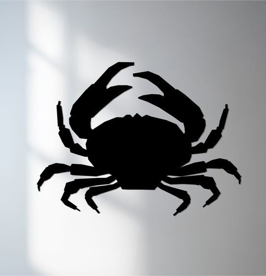 Angular decorative metal art shapes the silhouette of a crab, composed of geometric elements that create a modern coastal ocean wall art piece.