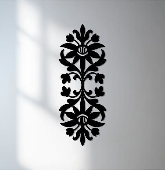 Foreground detail shows the intricate, decorative metal art of the Floral Harmony wall hanging, providing a unique focal point with its elegant black finish.