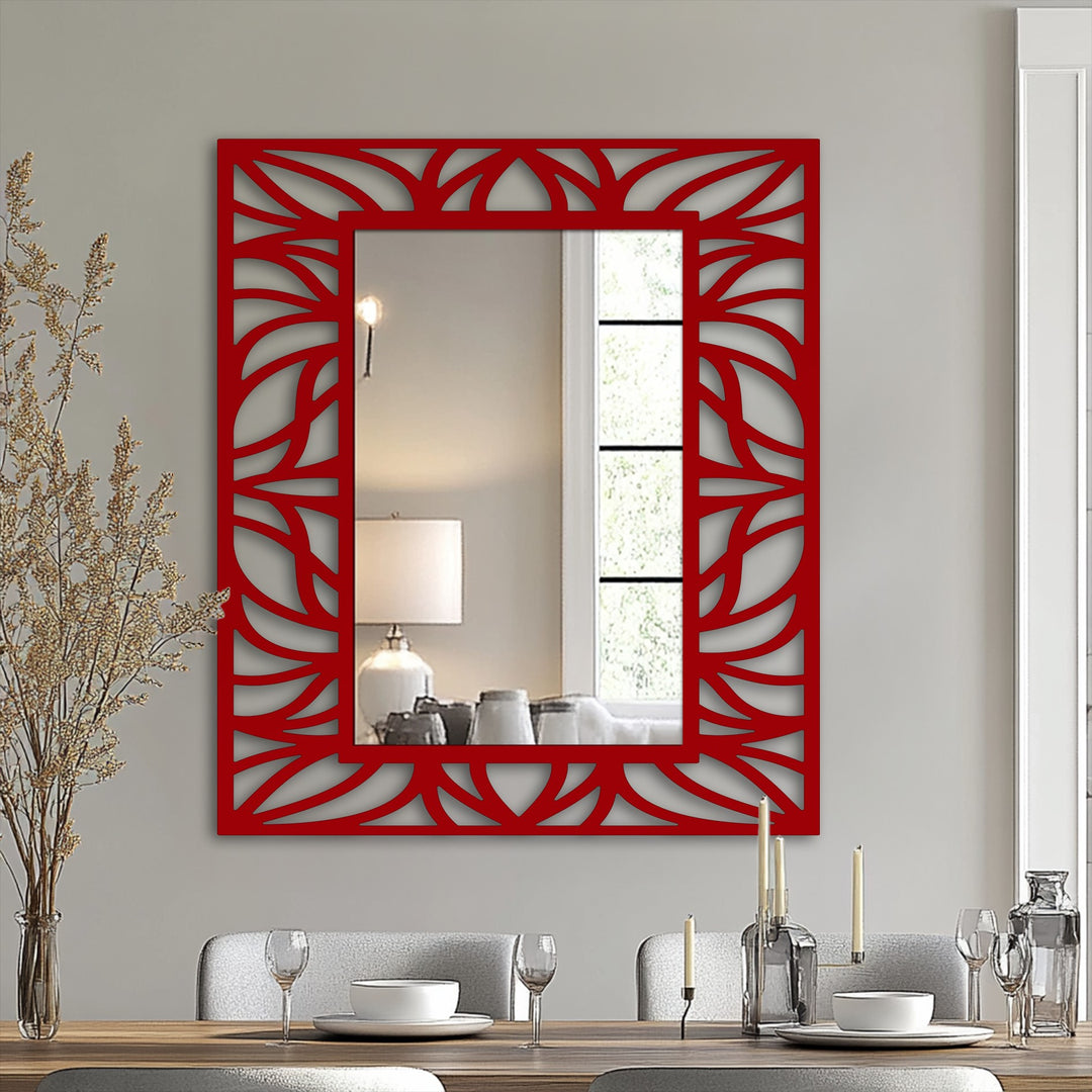 Organic frame details highlight the leaf pattern of this decorative metal art mirror, bringing flowing botanical shapes to a modern bathroom mirror.
