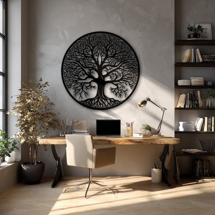 Organic forms of the intricate Tree of Life metal wall decor in a circular design elegantly highlight a textured wall above a rustic desk.