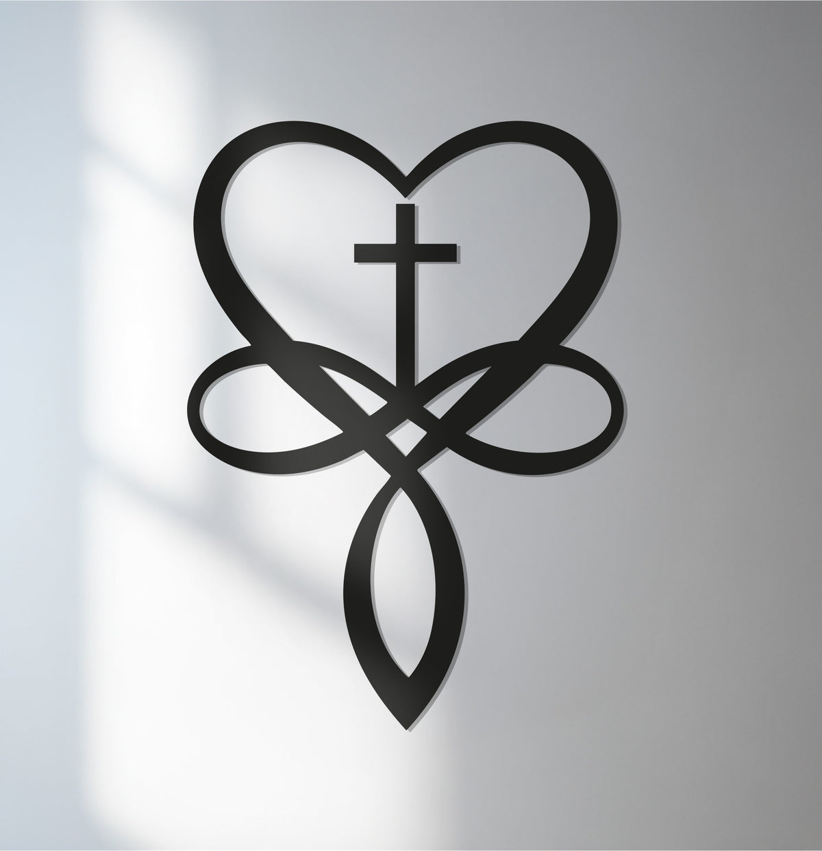 Experiencing the layering effect in this heart cross metal artwork, a black religious wall sculpture displaying a unique depth and symbolic form.