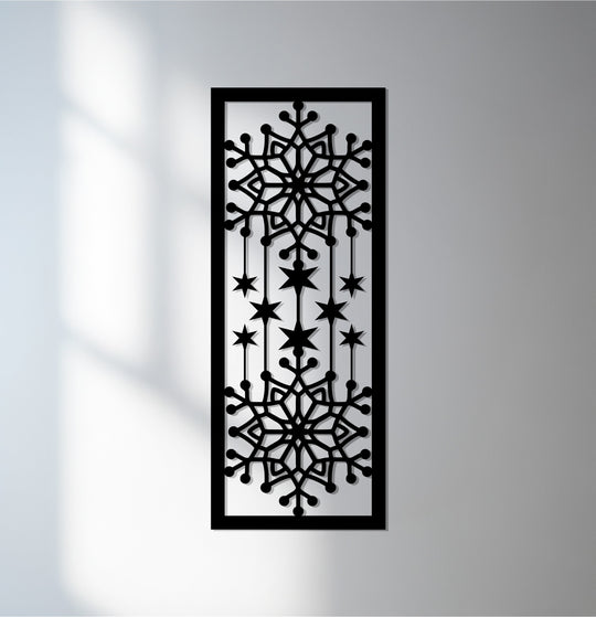 Illuminated area highlights the intricate cutouts of this decorative metal art panel depicting falling snowflakes and winter stars, adding a unique touch to any space.