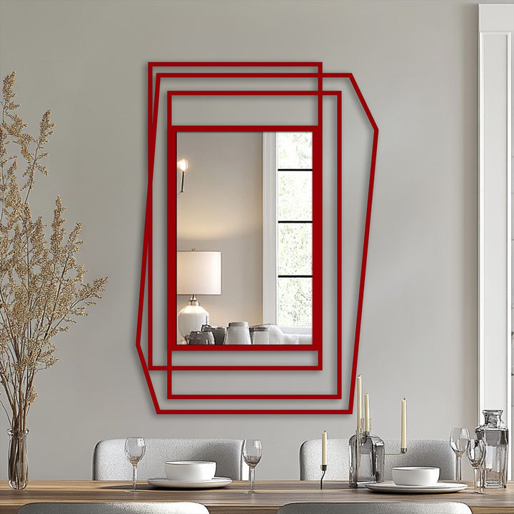 The stillness of the reflected room contrasts with the bold lines of the layered geometric asymmetrical frame, a piece of metal wall decor bringing artful design to any space.