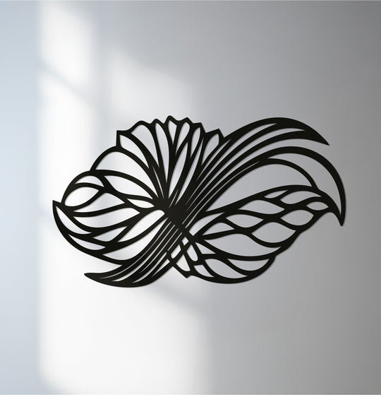 Subtle light and shadow play across this decoration wall art, highlighting the intricate, abstract floral wings in modern metal wall art.