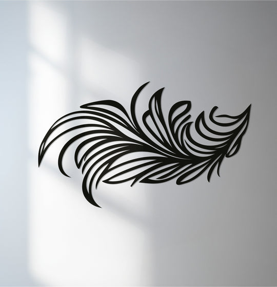 Subtle light and shadow accentuates the flowing lines of the decorative metal art feather, creating depth and visual interest.