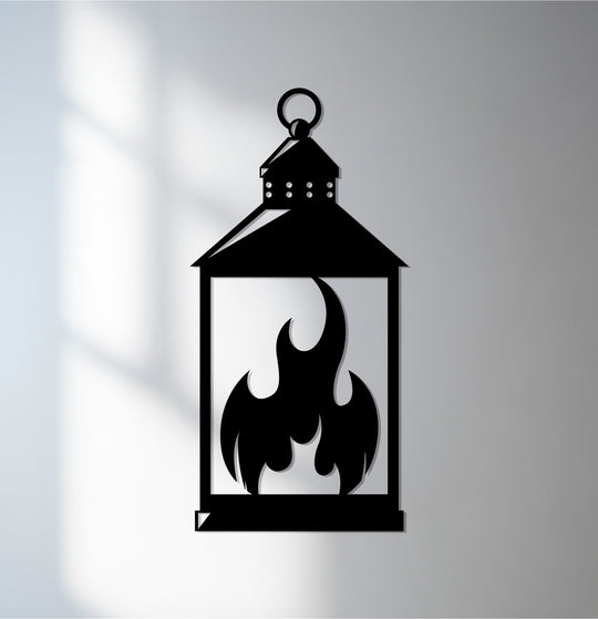 Black silhouette defines the lantern's decorative metal art casting shadows around the flame design within this modern Ramadan wall decor.