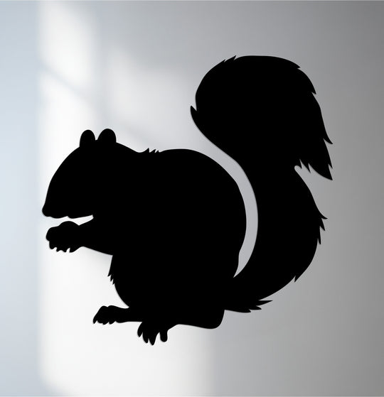 Soft light accentuates the squirrel silhouette metal wall art, highlighting the stark decoration wall art shadows cast around this nature-inspired design.