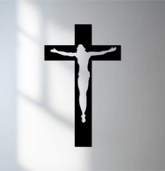 Diffuse light accentuates the sleek, minimalist crucifix design, a delicate balance in this striking metal art for wall depicting the divine reflection.
