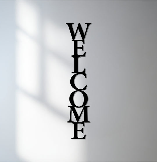 Negative space creates an intriguing silhouette around this vertical welcome sign, a modern example of metal artwork perfect for entryways.