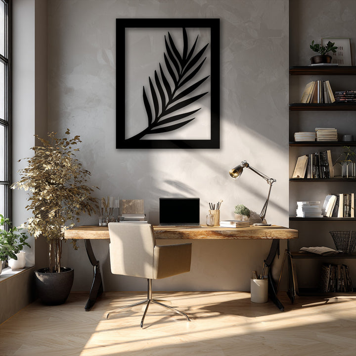The soft, neutral fabric of the office chair offers comfort beneath the striking Minimal Palm Leaf Silhouette metal artwork.