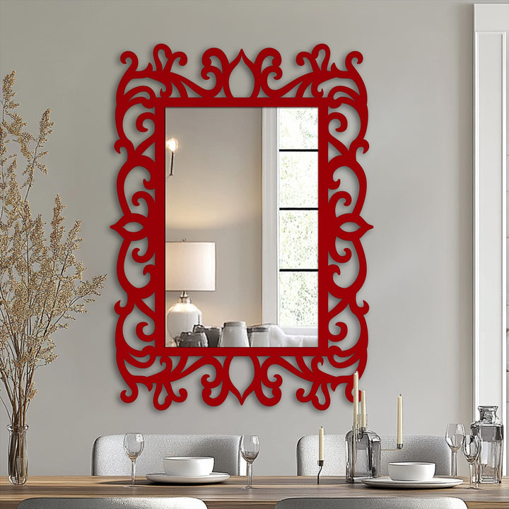 Vertically oriented, the ornate mirror features a decorative, floral metal frame that adds a touch of decoration wall art with its scroll shape.