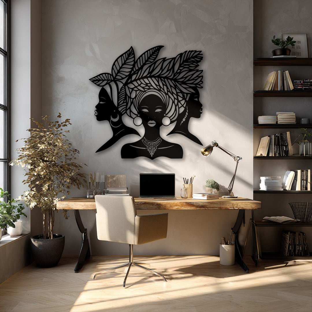 The darkest area highlights the unique metal wall art featuring elegant African women silhouettes and a detailed cultural portrait decor piece.