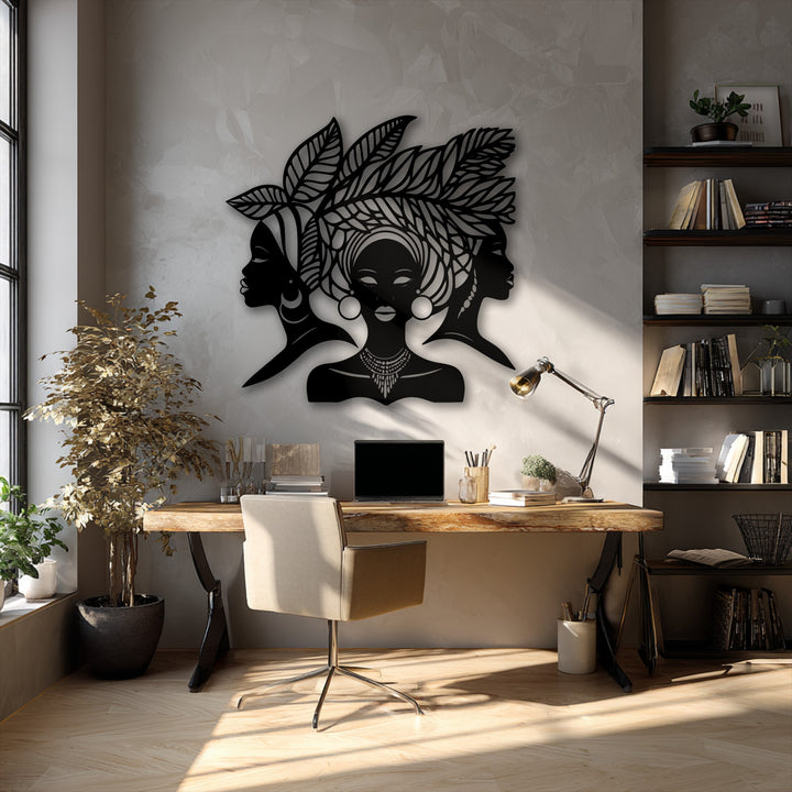 The darkest area highlights the unique metal wall art featuring elegant African women silhouettes and a detailed cultural portrait decor piece.