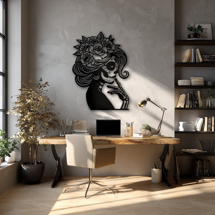 The textured concrete-style wall serves as a subtle background for the striking floral sugar skull lady metal wall decor.