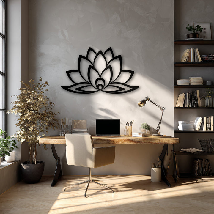 The subtly textured, light gray wall provides a serene backdrop for the sleek, matte black decorative metal art featuring a minimal lotus bloom.