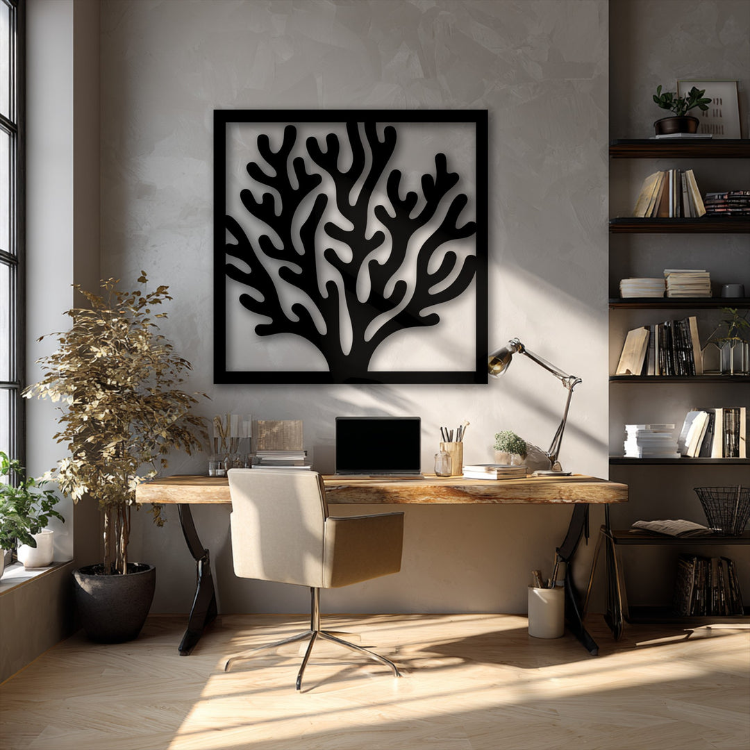 The unique metal wall art showcases a bold color contrast with its black coral frame design against a light, textured wall.