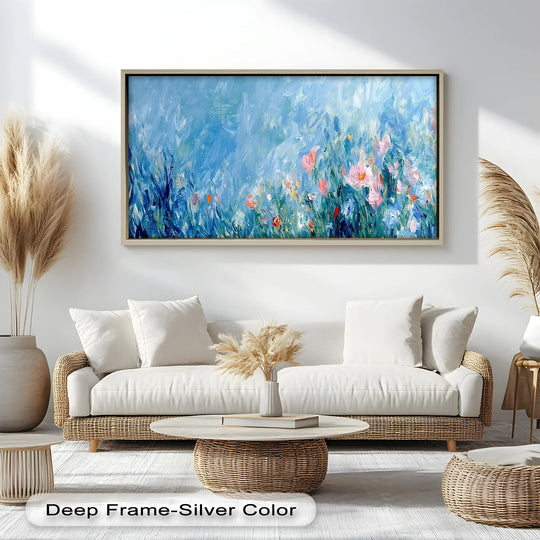 Framed with a deep, silver edge, this impressionist abstract floral oil painting artwork showcases vibrant blossoms in a blend of blues, pinks, and greens.