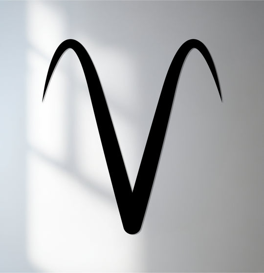 The stillness highlights the elegant curve of this Aries zodiac symbol in unique metal wall art, capturing the essence of astrology.