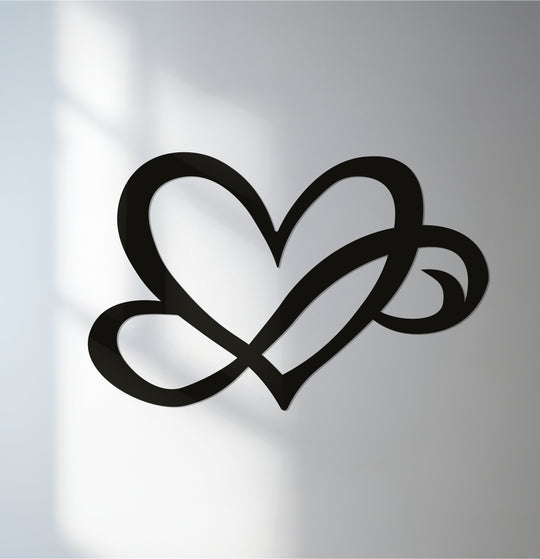 Featuring a smooth, matte finish, this unique metal wall art showcases an intertwined hearts design for a modern and romantic wall decor piece.